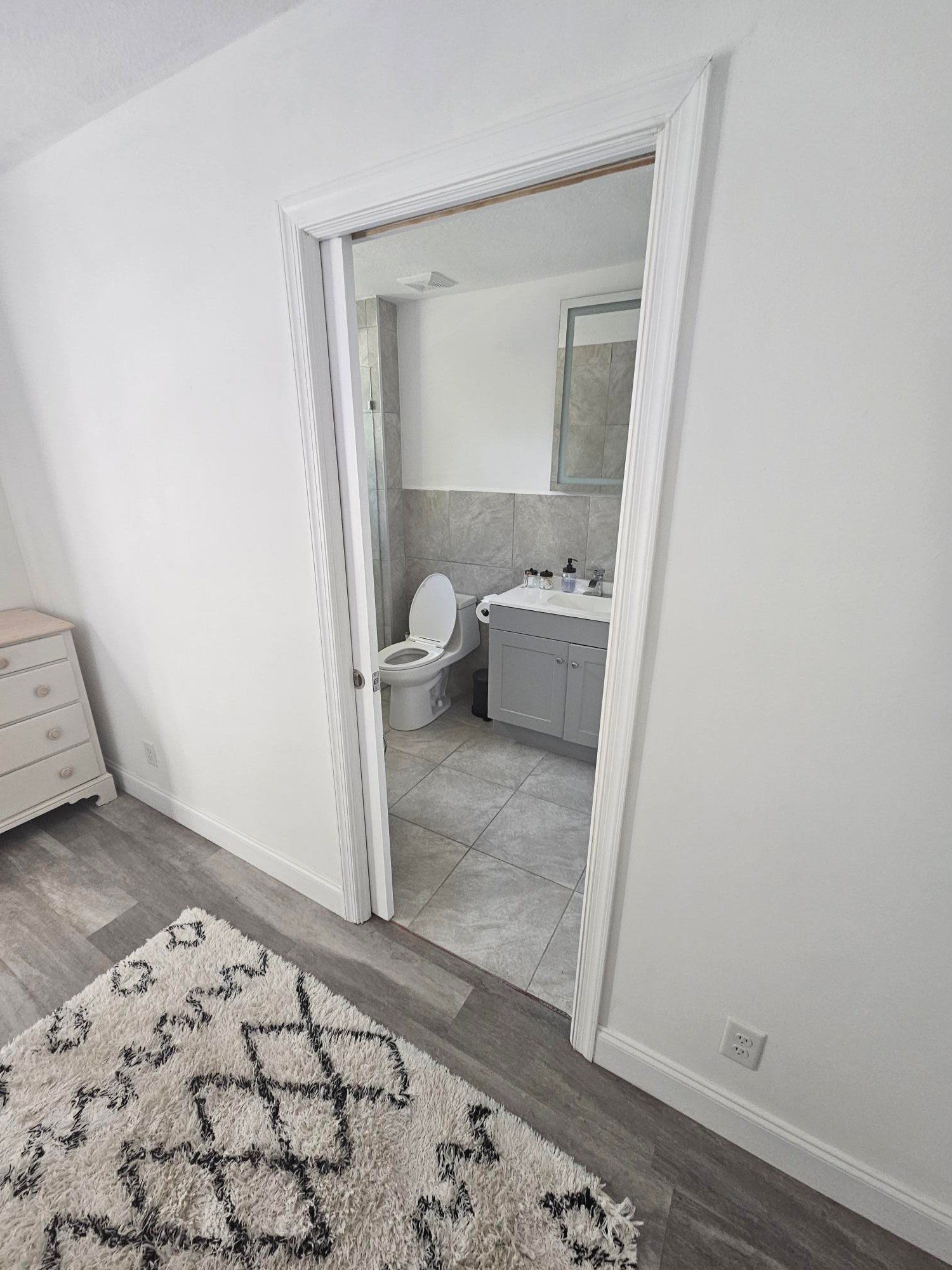 Bathroom seen through the bedroom door
